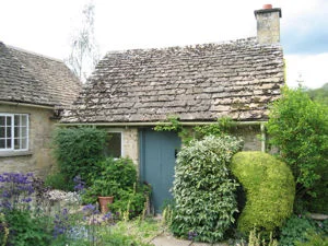 stone cottage with blue door
